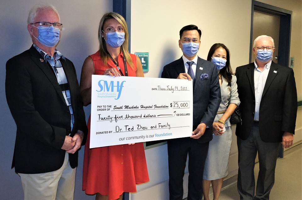 Evertrust Development dr.-ted-jiancheng-zhou-presenting-cheque-to-bracebridge-hospital-with-wife-and-dignitaries Another Successful Year of Developing Happy and Healthy Lifestyles Across Canada in 2022  
